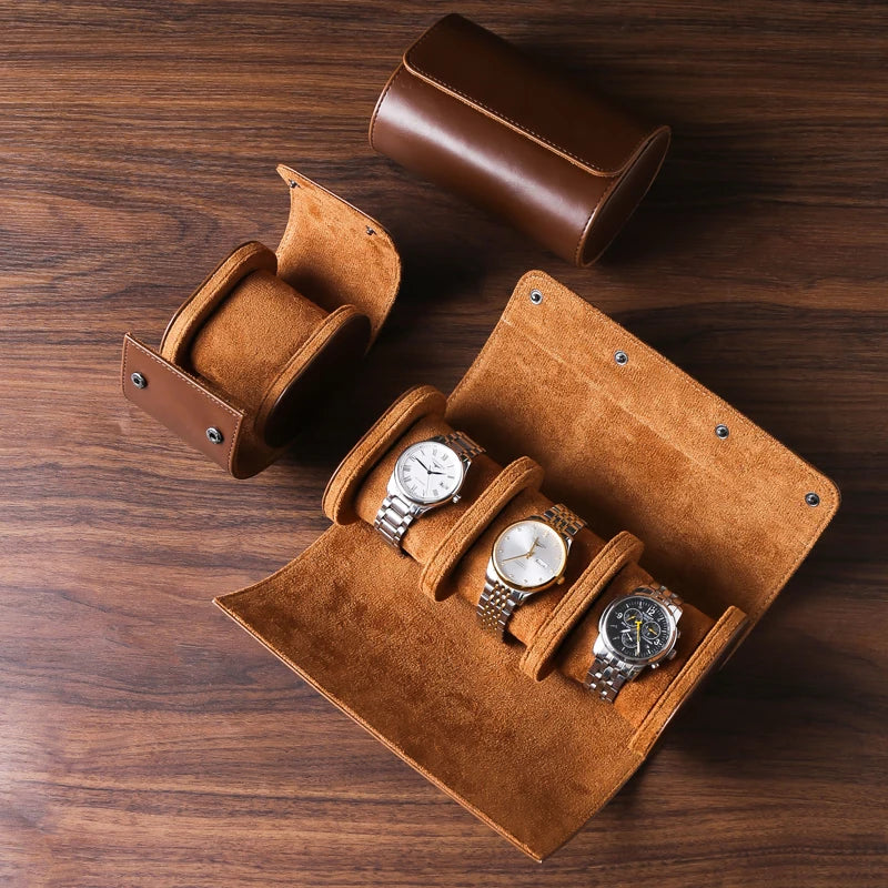 Cognac Tan watch rolls with watches on a wooden table